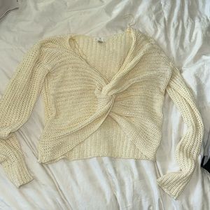 white/beige sweater that crosses- does show stomach